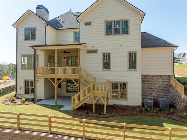 a view of a white house with large windows