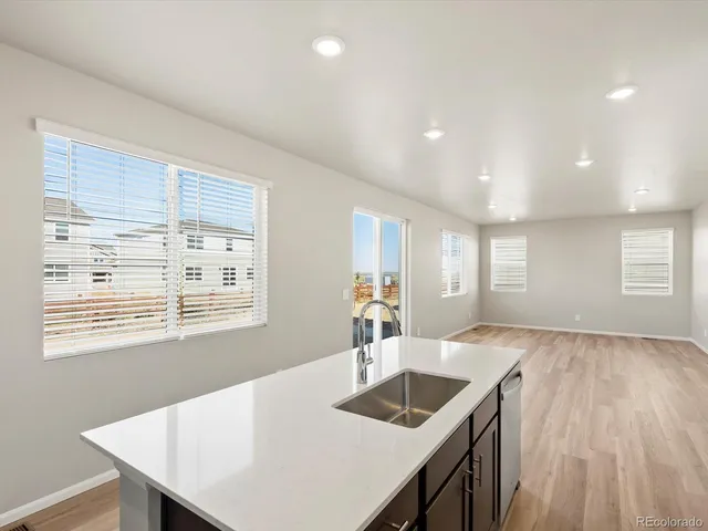 a kitchen with center island wooden floor and center island