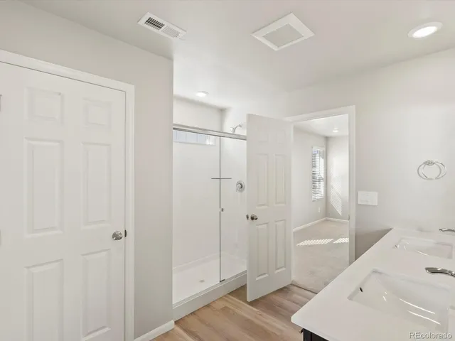 a bathroom with a bathtub and shower