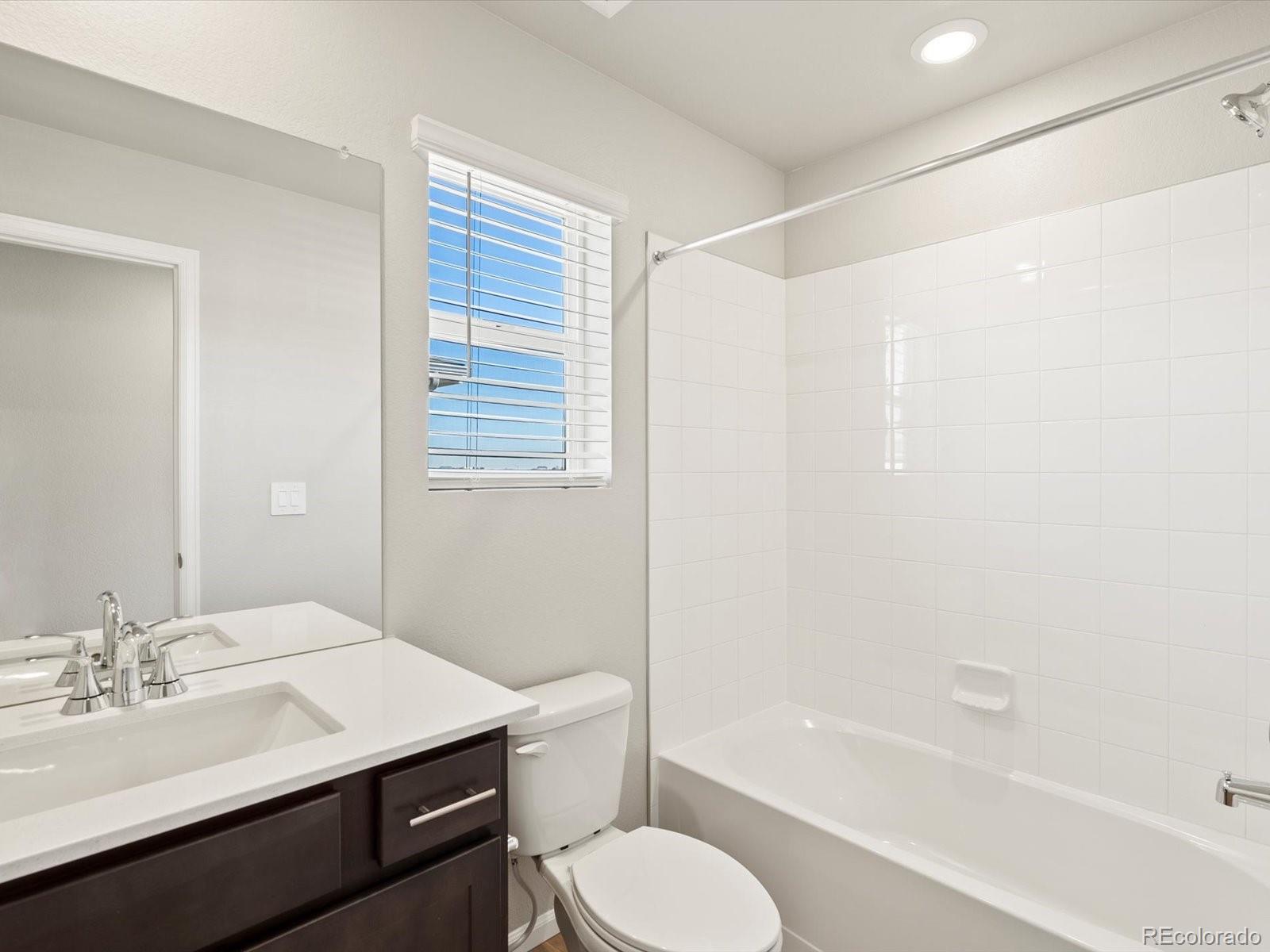 4673 Rabbitbrush Street Johnstown, CO 80534 - Photo 26 of 31 a bathroom with a sink toilet and shower