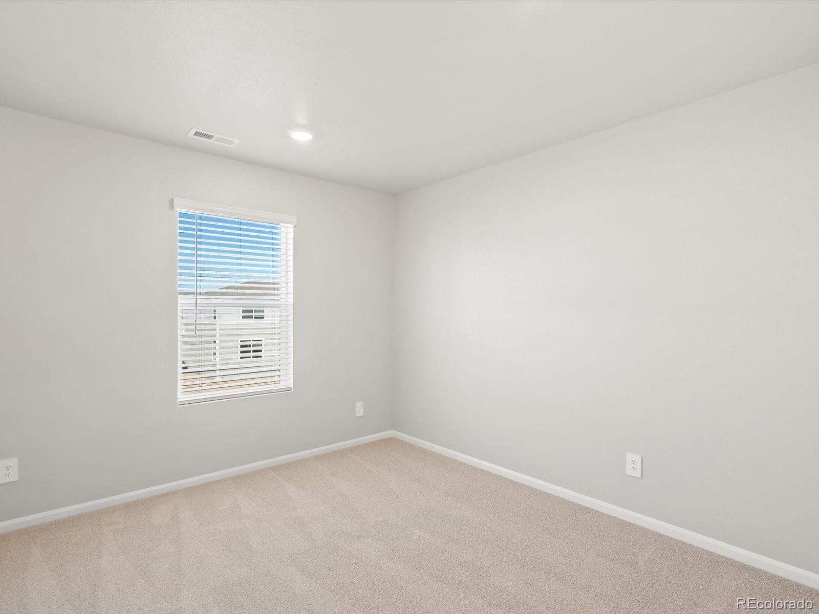 4673 Rabbitbrush Street Johnstown, CO 80534 - Photo 27 of 31 an empty room with a window