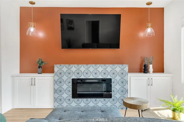 a view of kitchen with furniture and wooden floor