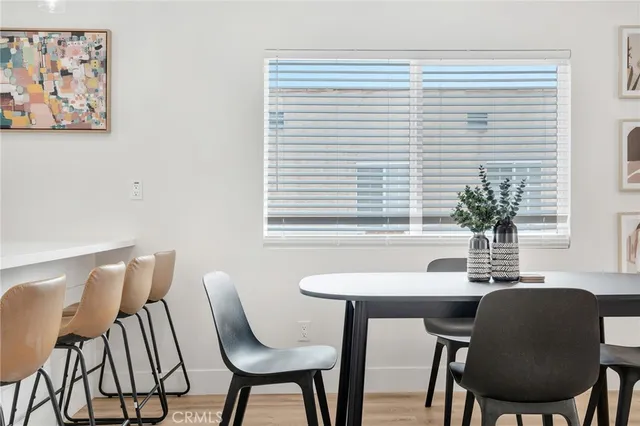a view of a dining room with furniture and window