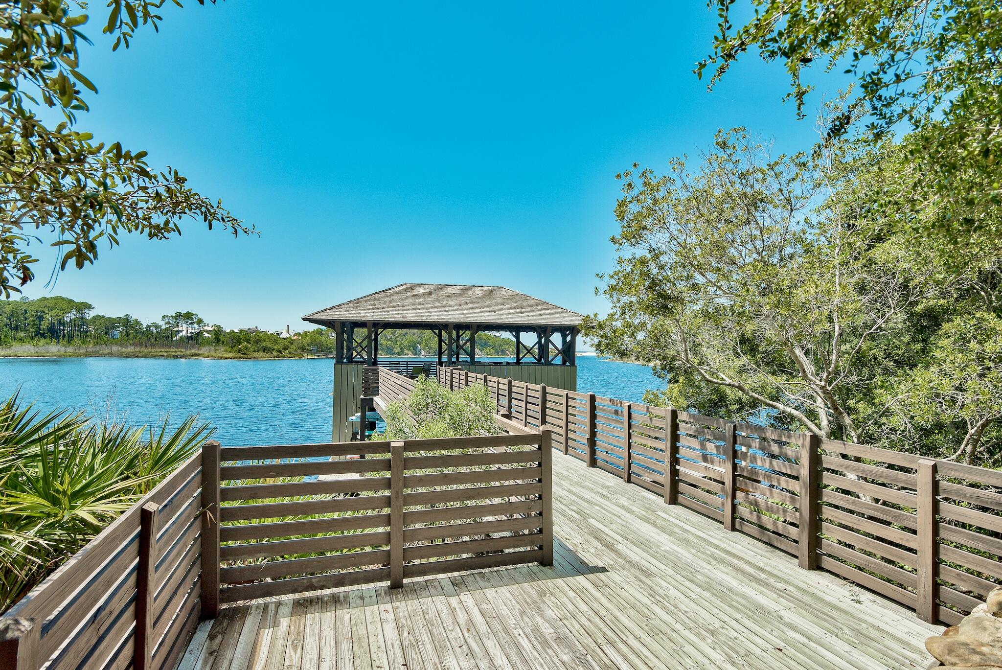 a view of a deck with chairs and wooden floor