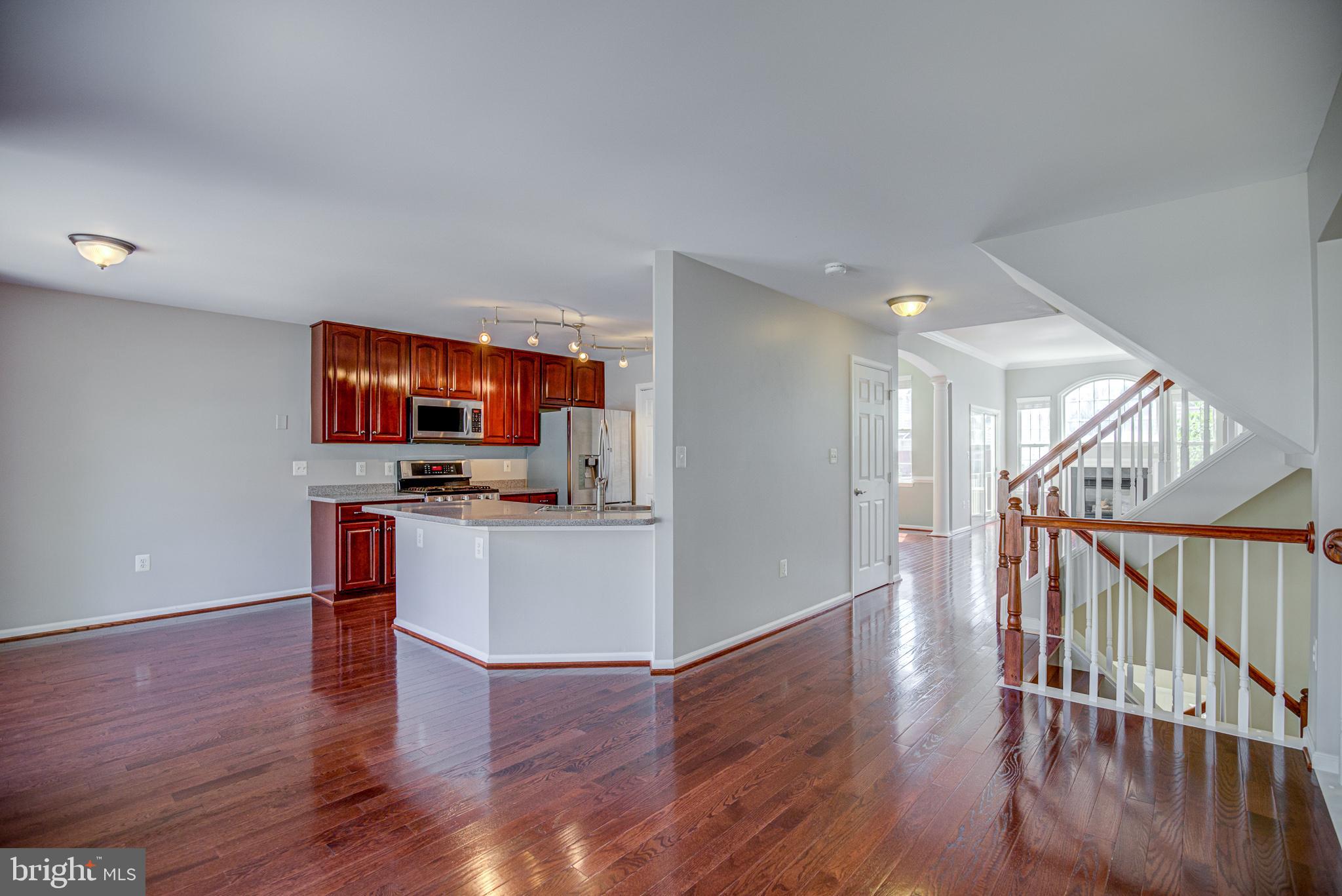 20609 Glenmere Square Sterling, VA 20165 - Photo 11 of 50 Living room open to kitchen