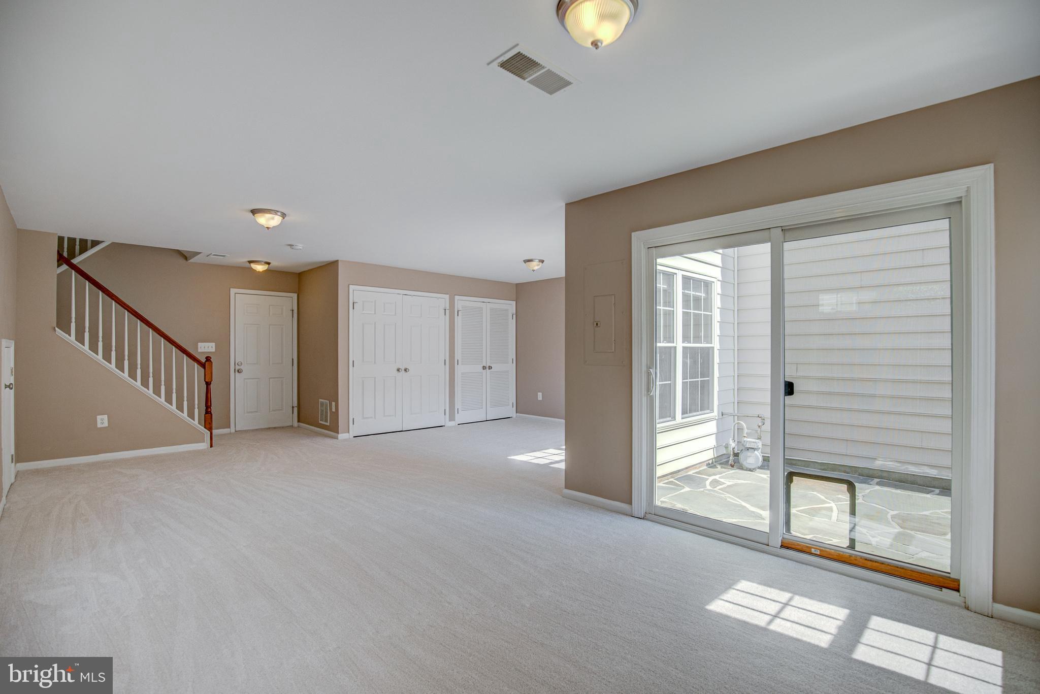 20609 Glenmere Square Sterling, VA 20165 - Photo 39 of 50 Lower level leads to private stone patio