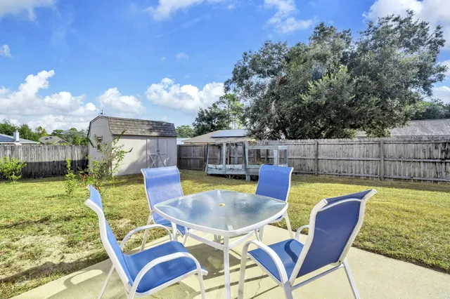 a view of a swimming pool with a patio