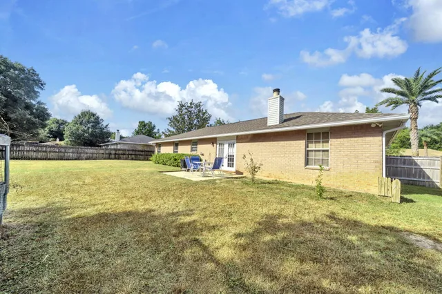 a front view of house with yard and entertaining space