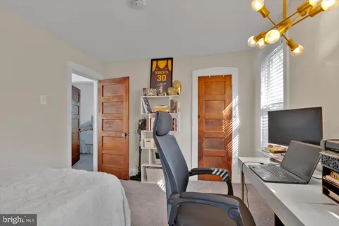 a bedroom with a bed and closet