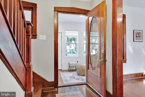 a view of an entryway with wooden floor