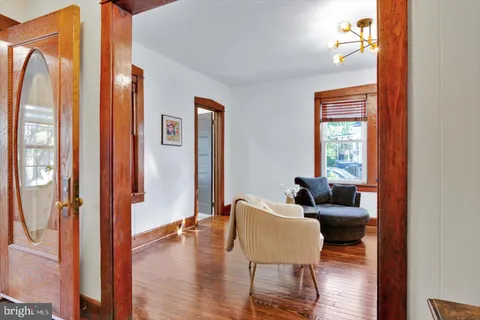 a living room with furniture and a painting