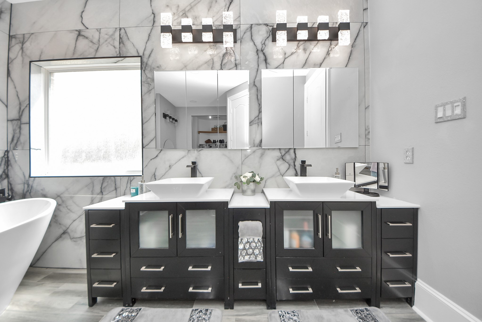 28115 Kudzu Drive Spring, TX 77386 - Photo 20 of 39 a bathroom with a double vanity sink and mirror