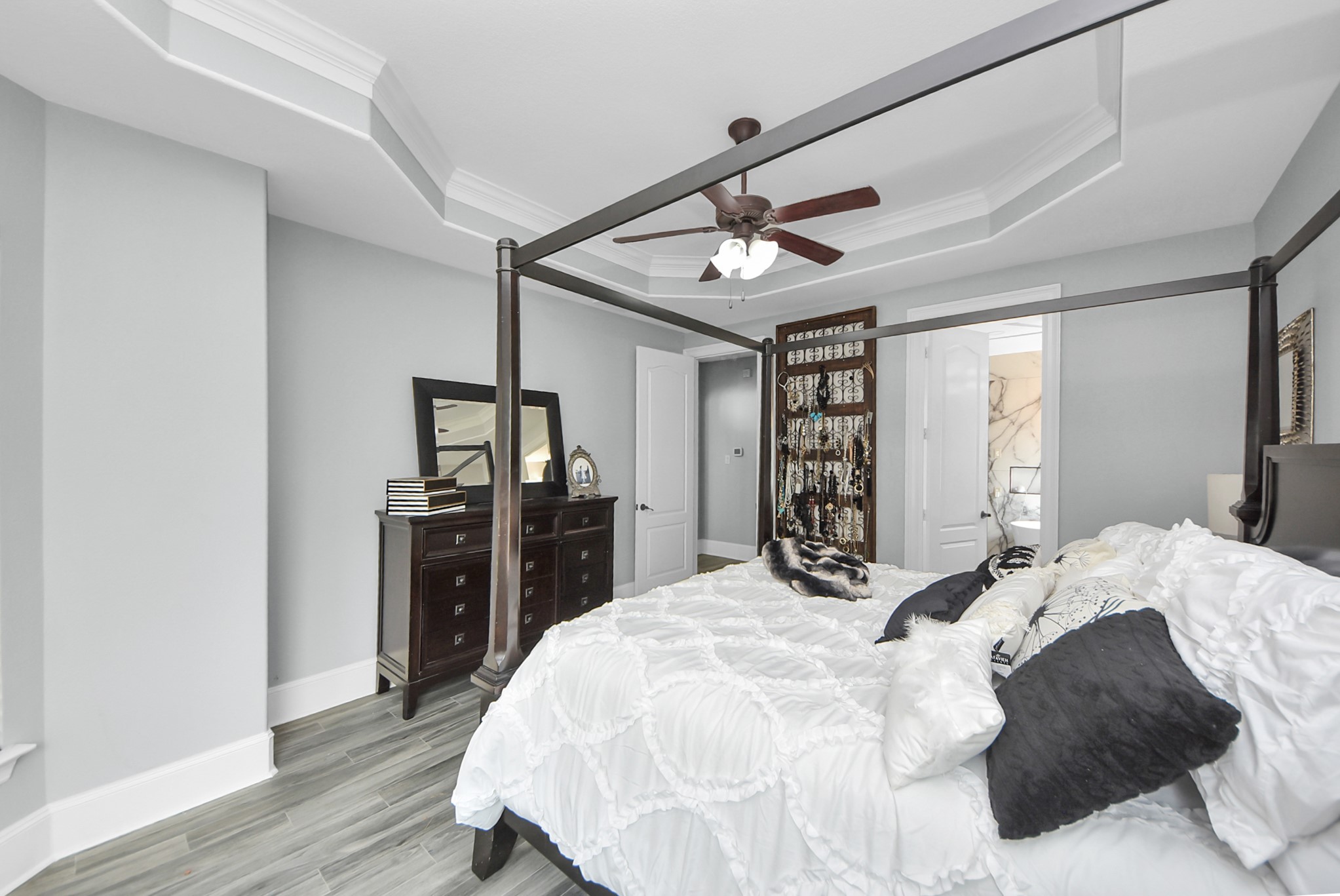 28115 Kudzu Drive Spring, TX 77386 - Photo 28 of 39 a large bedroom with a bed and wooden floor