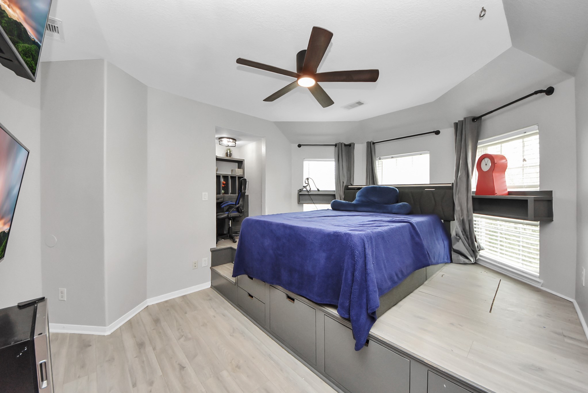 28115 Kudzu Drive Spring, TX 77386 - Photo 32 of 39 a spacious bedroom with a bed and a flat screen tv