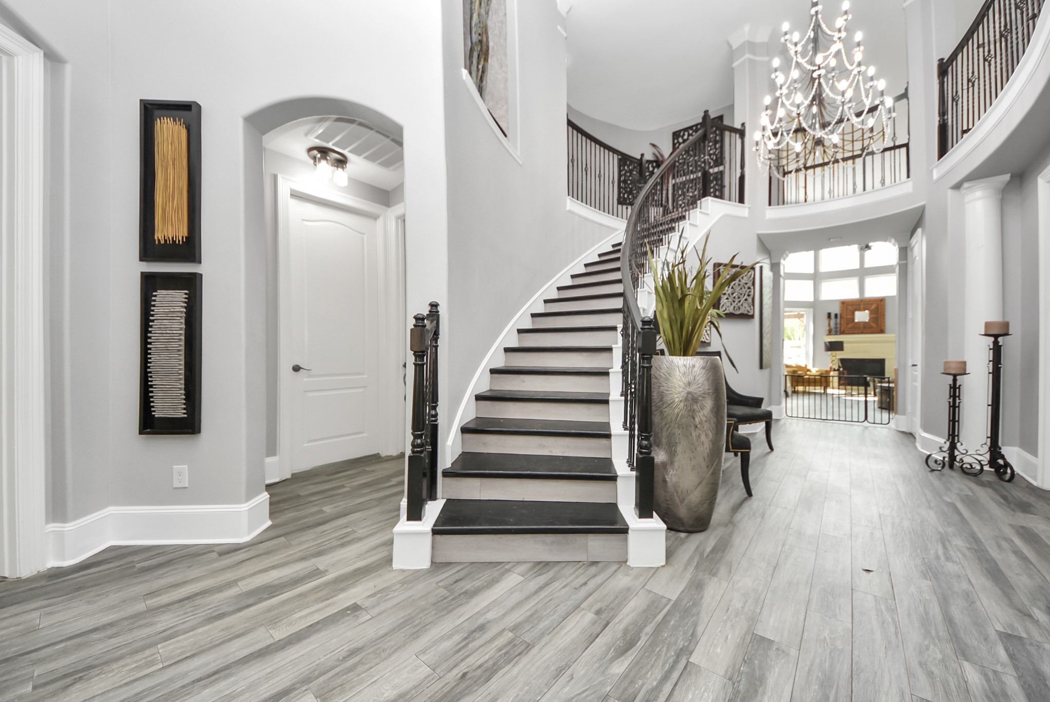 28115 Kudzu Drive Spring, TX 77386 - Photo 4 of 39 a view of a hallway with wooden floor and stairs