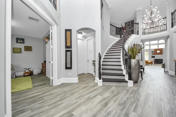 a view of a hallway view with wooden floor and staircase