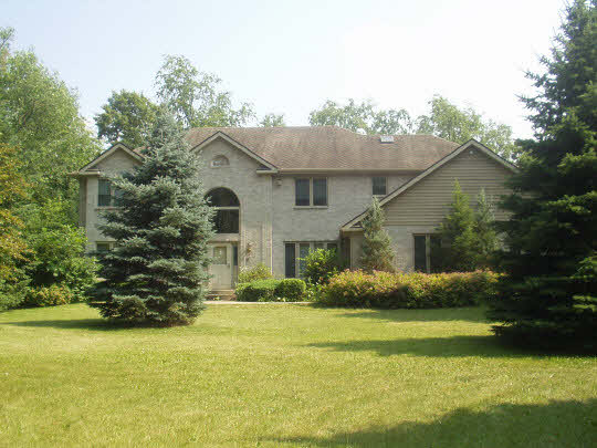 1151 Krupke Road Caledonia, IL 61011 - Photo 2 of 7 a front view of house with yard and green space