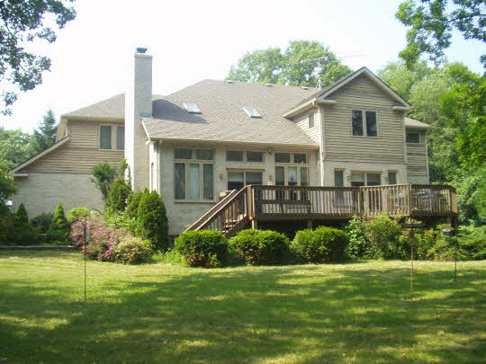 1151 Krupke Road Caledonia, IL 61011 - Photo 3 of 7 a front view of a house with a yard and potted plants