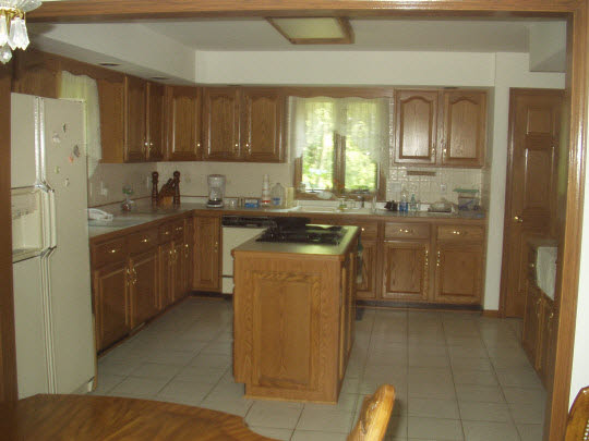 1151 Krupke Road Caledonia, IL 61011 - Photo 6 of 7 a kitchen with a sink a stove and cabinets