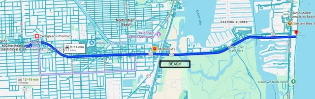 a white wall under a large mirror