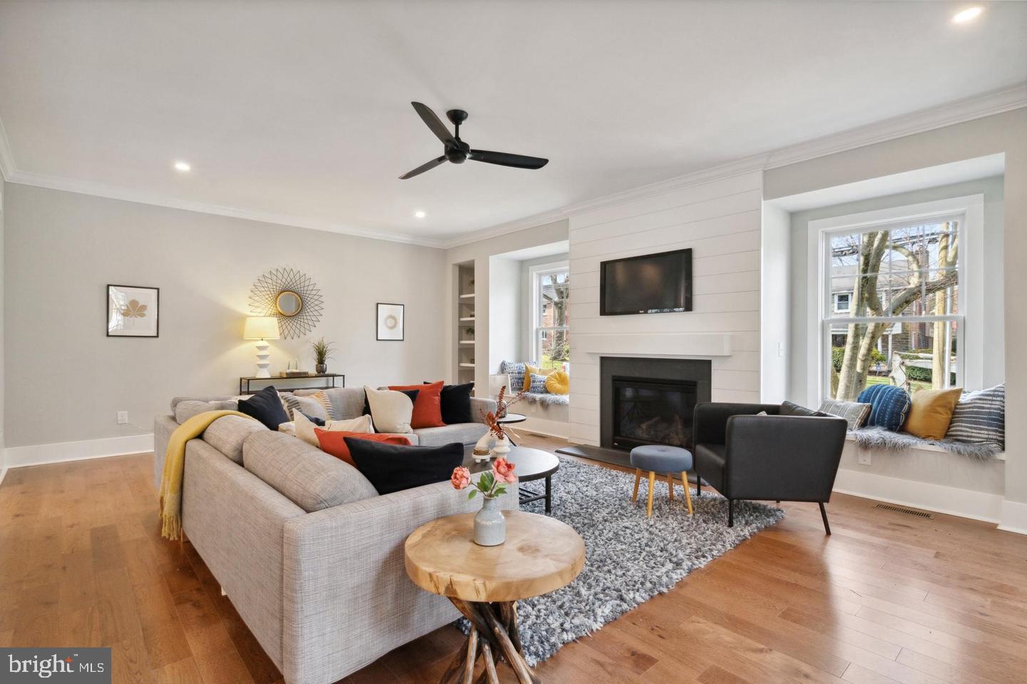 111 St Pauls Road Ardmore, PA 19003 - Photo 8 of 14 a living room with furniture a fireplace and a large window