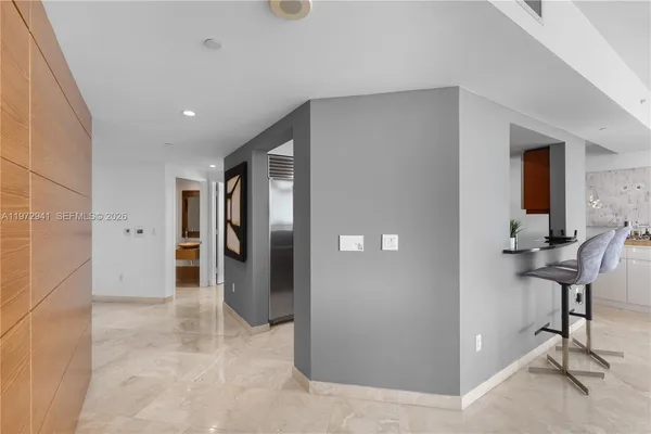 a view of a livingroom with a furniture and a refrigerator