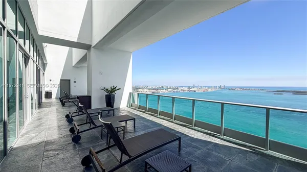 a view of a balcony with chairs