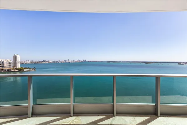 a view of a balcony with ocean view