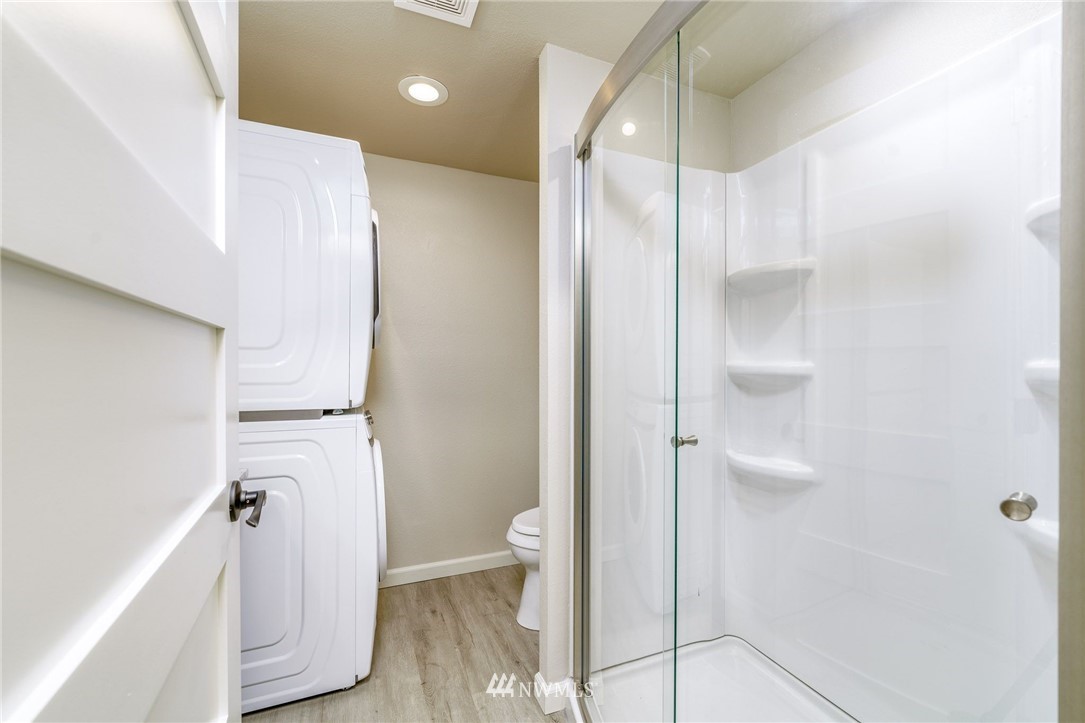 2926 Northeast 5th Place Renton, WA 98056 - Photo 15 of 40 a bathroom with a glass shower door