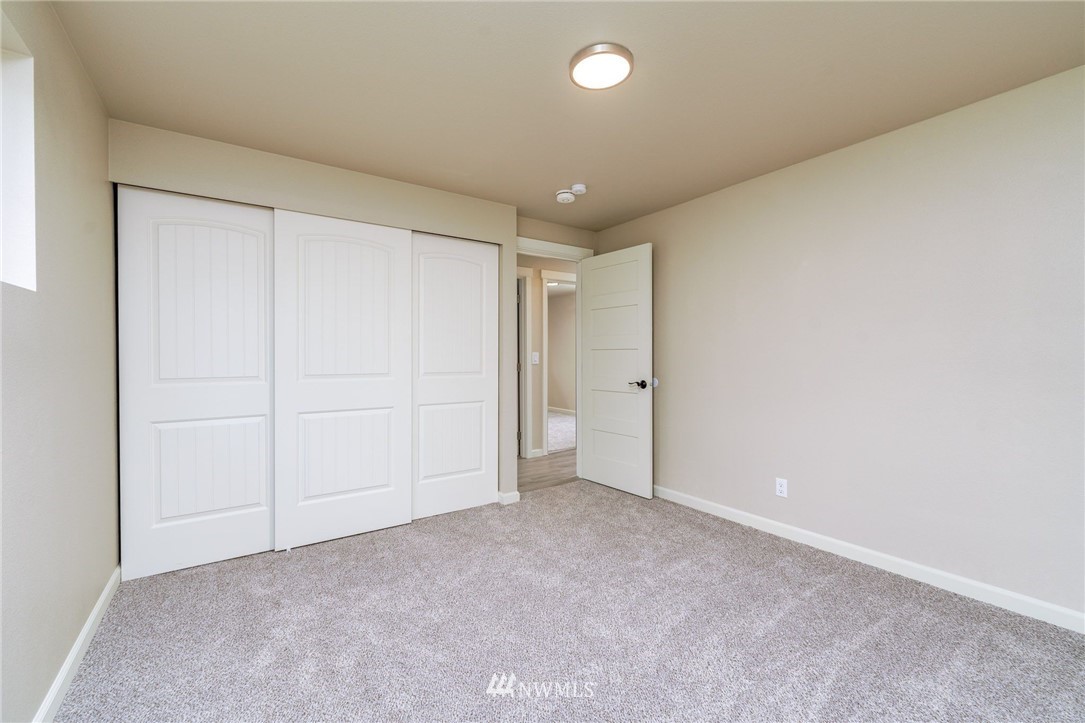 2926 Northeast 5th Place Renton, WA 98056 - Photo 20 of 40 a kitchen with granite countertop a sink and a stove