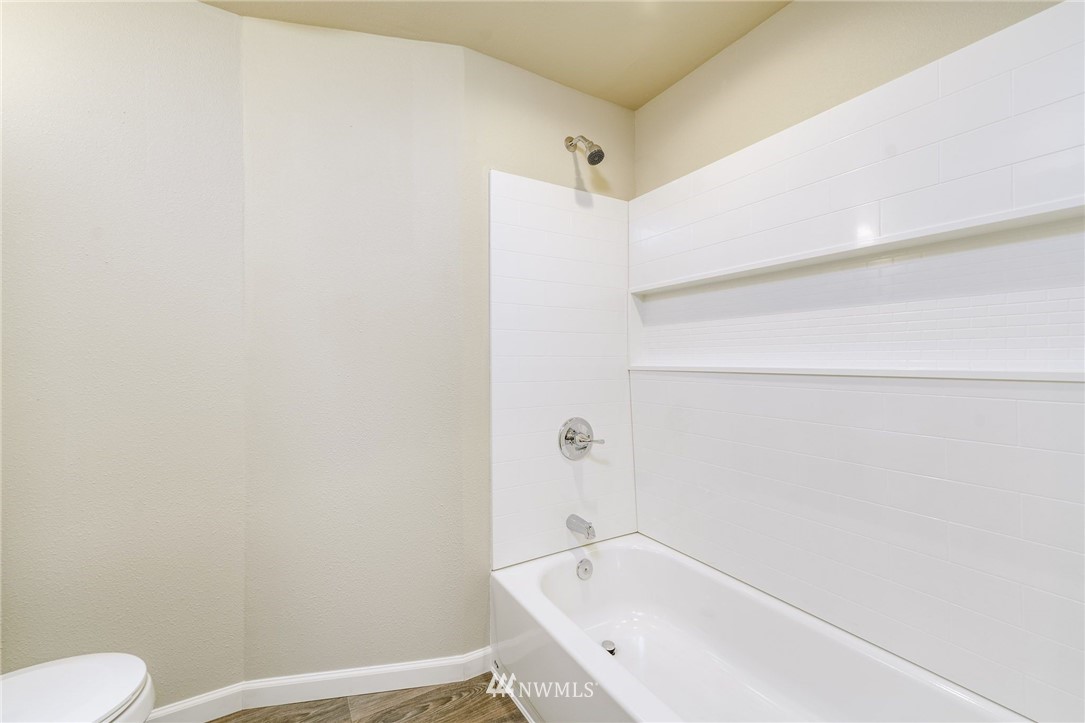 2926 Northeast 5th Place Renton, WA 98056 - Photo 23 of 40 a bathroom with a bathtub and toilet