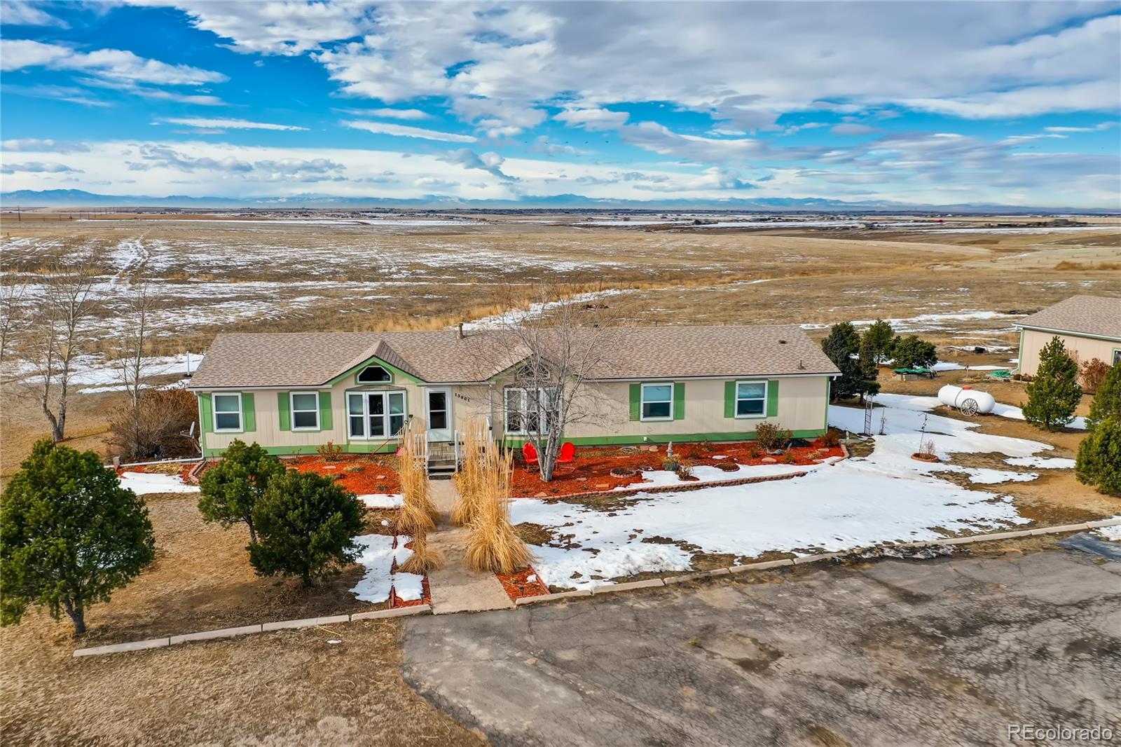 an aerial view of residential houses with outdoor space
