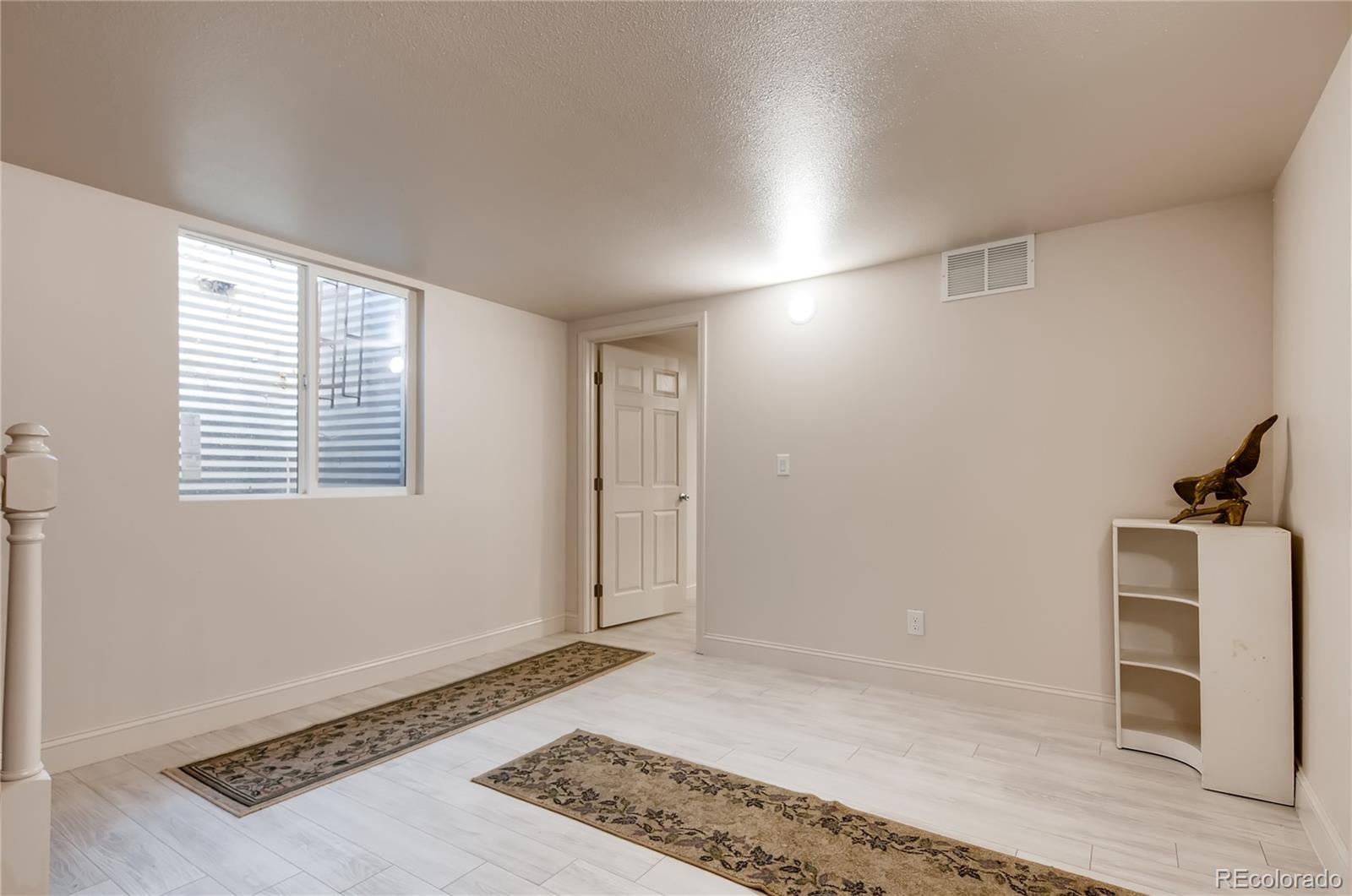 13801 Cavanaugh Road Hudson, CO 80642 - Photo 23 of 39 a view of an empty room with a window