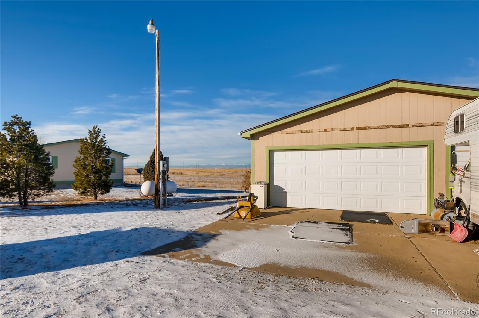 13801 Cavanaugh Road Hudson, CO 80642 - Photo 28 of 39 a view of a house with a backyard