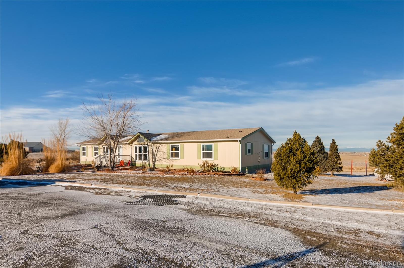 13801 Cavanaugh Road Hudson, CO 80642 - Photo 4 of 39 a view of a house with a outdoor space