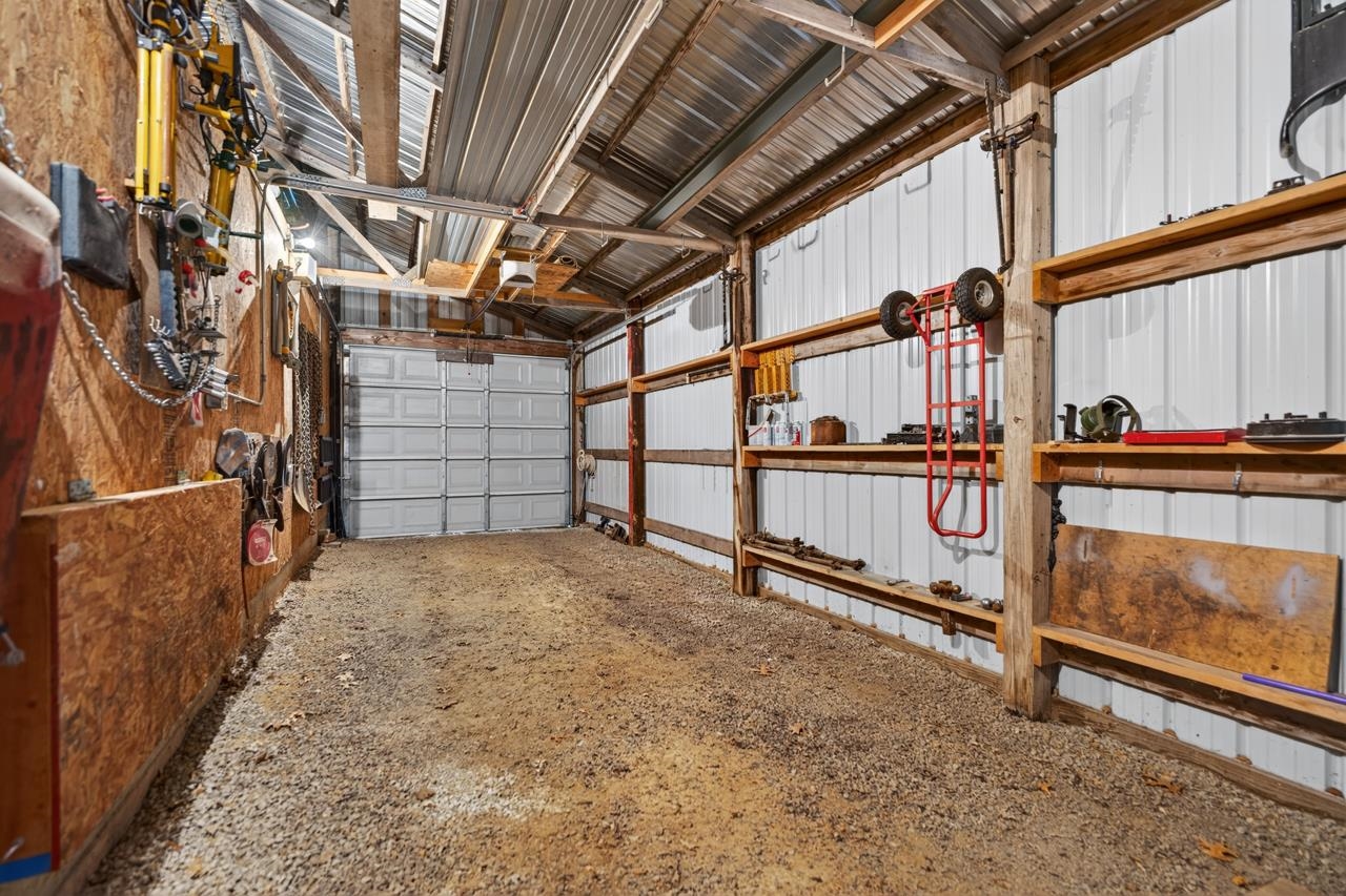 1392 Red Brick Road Dixon, IL 61021 - Photo 42 of 52 a view of a garage with wooden walls