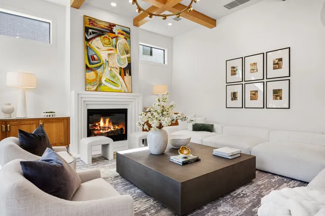 a kitchen with kitchen island stainless steel appliances a sink a counter top space stove and cabinets