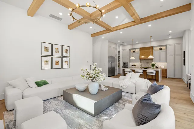 a kitchen with granite countertop a stove and a white cabinets
