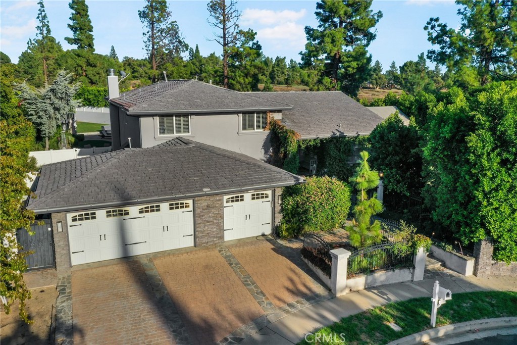10710 Belmar Avenue Porter Ranch, CA 91326 - Photo 1 of 1 an aerial view of a house with yard and outdoor seating