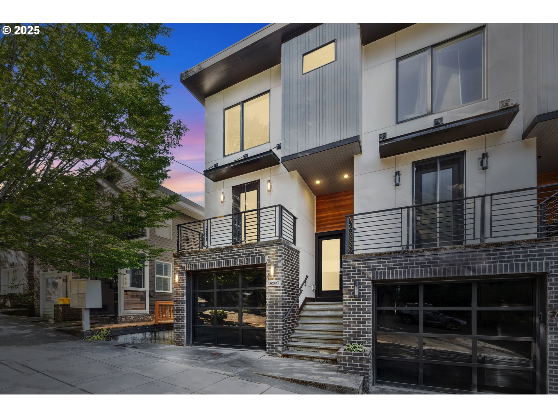 1625 Southwest Montgomery Street, Unit C Portland, OR 97201 - Photo 1 of 41 a view of a house with a barbeque and large trees