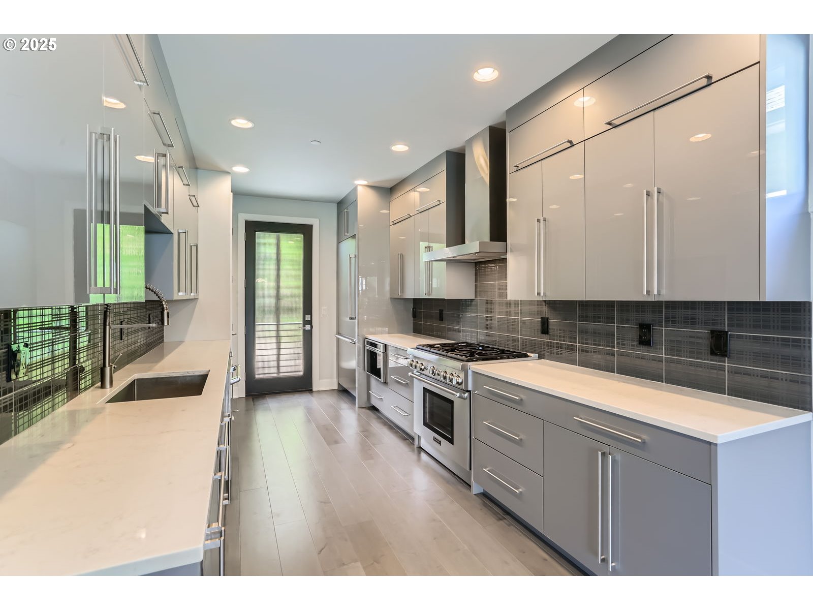 1625 Southwest Montgomery Street, Unit C Portland, OR 97201 - Photo 12 of 41 a kitchen with stainless steel appliances granite countertop a sink a stove and a refrigerator