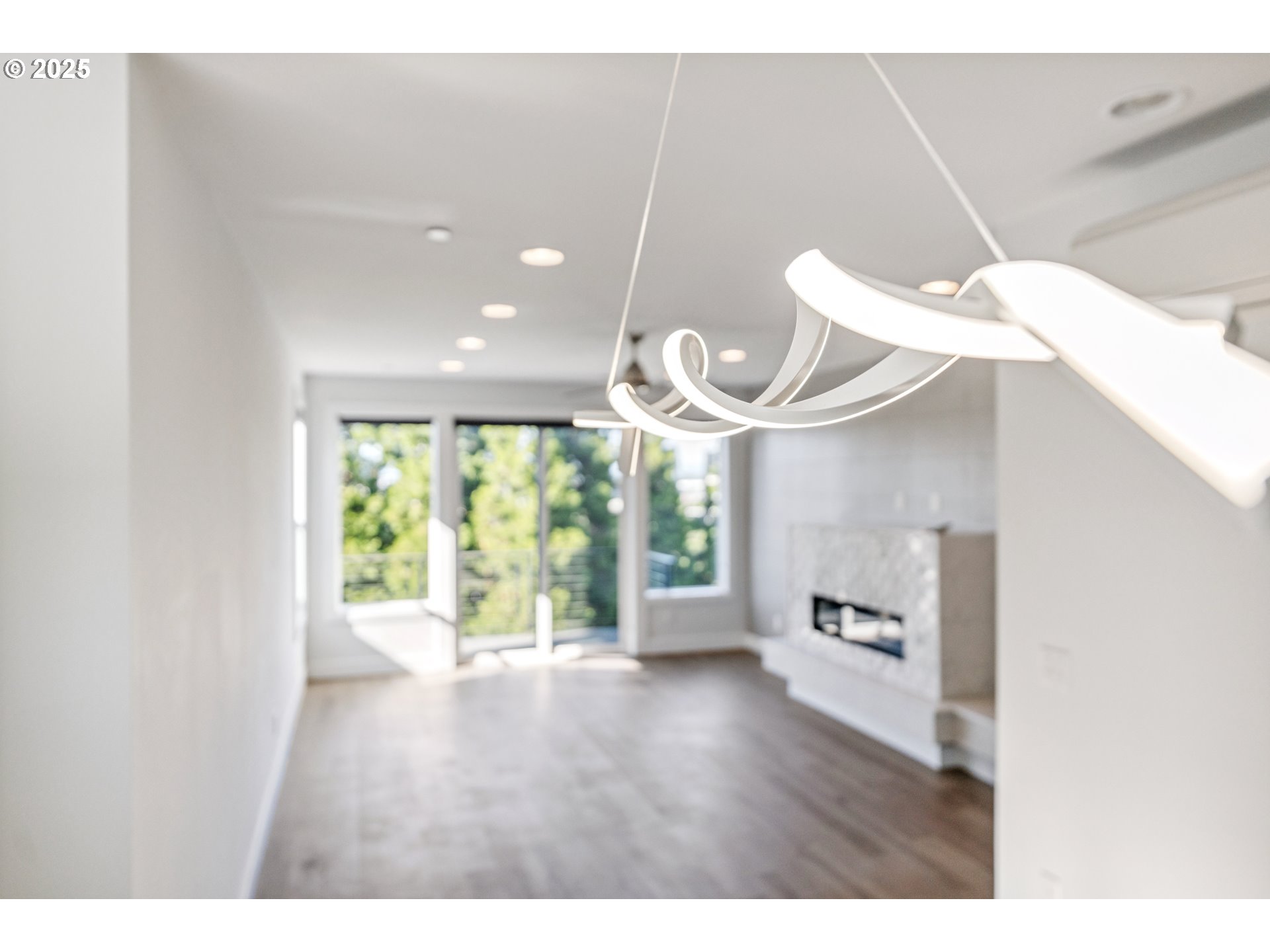 1625 Southwest Montgomery Street, Unit C Portland, OR 97201 - Photo 10 of 41 a view of an empty room with a window and wooden floor