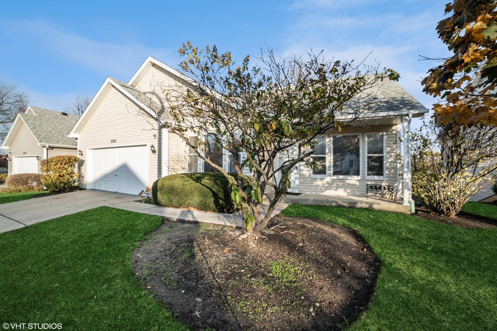 2323 Bluejay Trail Elgin, IL 60123 - Photo 2 of 18 a view of a house with backyard and a tree