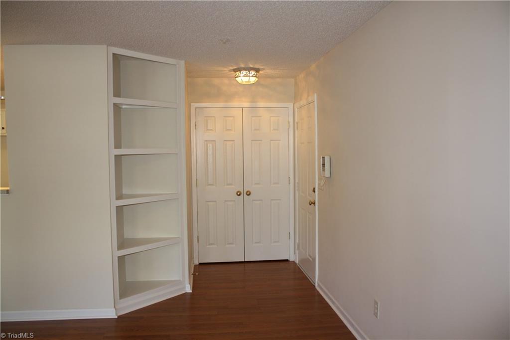 140 1A James Road High Point, NC 27265 - Photo 4 of 11 Custom shelving and coat closet at common entrance.