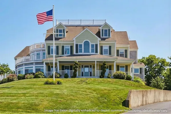 a front view of a house with a garden
