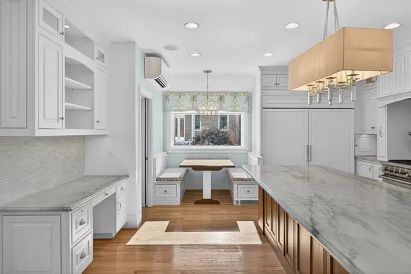 a kitchen with granite countertop stainless steel appliances and wooden cabinets