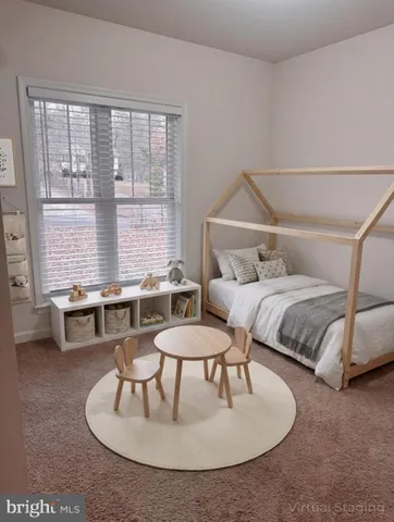 a bedroom with a bed and a table