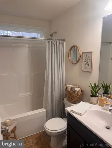 a bathroom with a sink a toilet and a bathtub