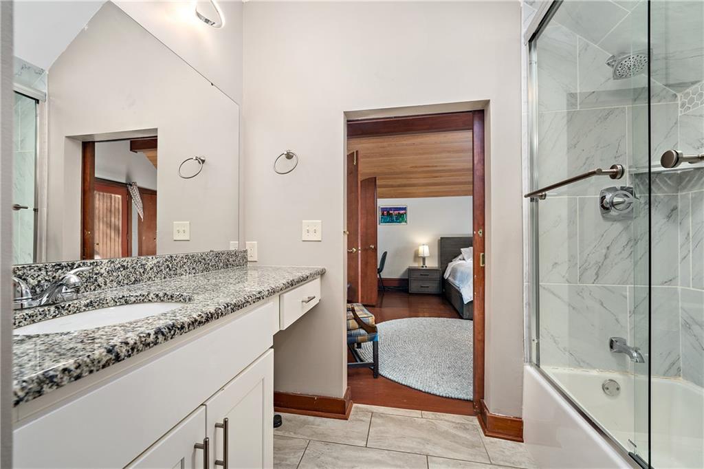 178 Backbone Road Sewickley, PA 15143 - Photo 15 of 25 a en suite bathroom with a granite countertop sink and a mirror