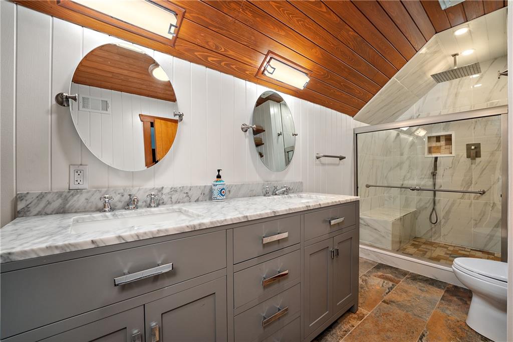 178 Backbone Road Sewickley, PA 15143 - Photo 17 of 25 a bathroom with a granite countertop toilet sink and mirror